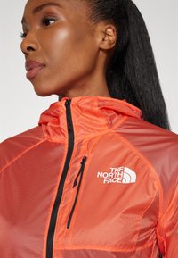 The North Face SHELL - Windbreakers - radiant orange/black