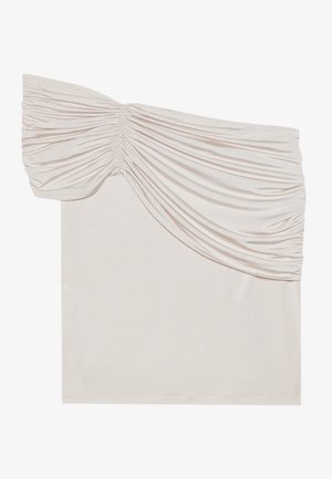 Asymmetrical off-shoulder top in light beige, featuring gathered fabric on one side and a smooth, untextured body.