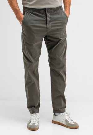 Gray lightweight chinos with an elastic waistband, side pockets, and a straight-leg fit, paired with white and gray sneakers.