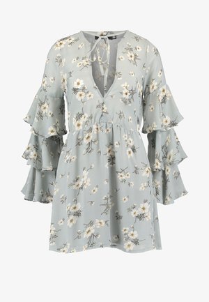 Floral dress in light blue fabric with a v-neckline, ruffled bell sleeves, and a fitted waist. Features white and yellow flower patterns.