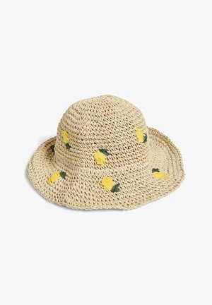 Chapeau de soleil en paille tissée beige avec un large bord, décoré de petits citrons jaunes et de feuilles vertes brodées autour de la calotte et du bord.