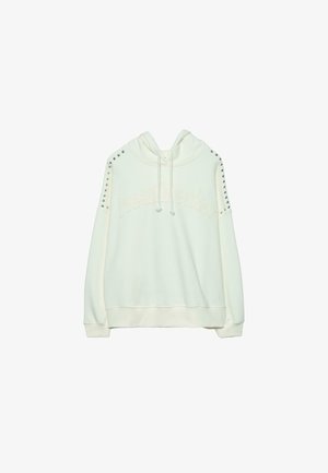 Felpa con cappuccio color crema chiaro con la scritta "heartbreaker" sul davanti, caratterizzata da dettagli borchiati sulle spalle e cappuccio con coulisse. Tessuto morbido al tatto.