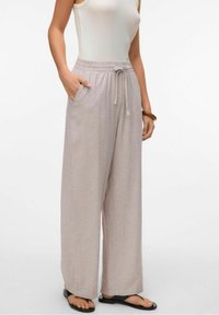 Lichtbeige wijde broek met een elastische tailleband, koord en zijzakken, gemaakt van een zachte, gestructureerde stof.