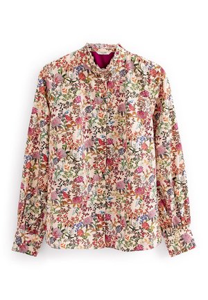 Langærmet bluse med blomsterprint, høj flæsekant, knapper foran og flerfarvet mønster af pink, lilla, grøn og orange blomster på cremefarvet baggrund.