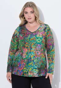 Maglietta a maniche lunghe con un vivace motivo a pelle di serpente multicolore, con scollatura a V e un tessuto liscio ed elasticizzato.