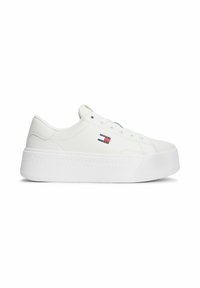 White platform sneaker with lace-up front, embossed "Tommy Jeans" on sole, and small Tommy Hilfiger logo on side.