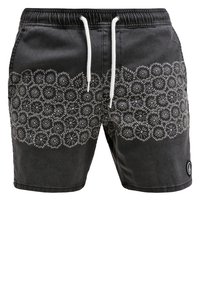 Black shorts with elastic waistband and white drawstring. Bottom features a white floral pattern. Includes a small branded logo on the side.
