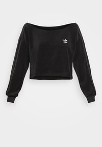 Svart kortärmad Adidas-tröja med båtamar, ribbade mudd, subtila axelr änder och vitt Adidas-logotyp på bröstet.