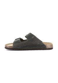 Infradito neri con una fascia ampia, soletta in sughero e suola in gomma testurizzata. Presentano ritagli per traspirabilità e comfort.