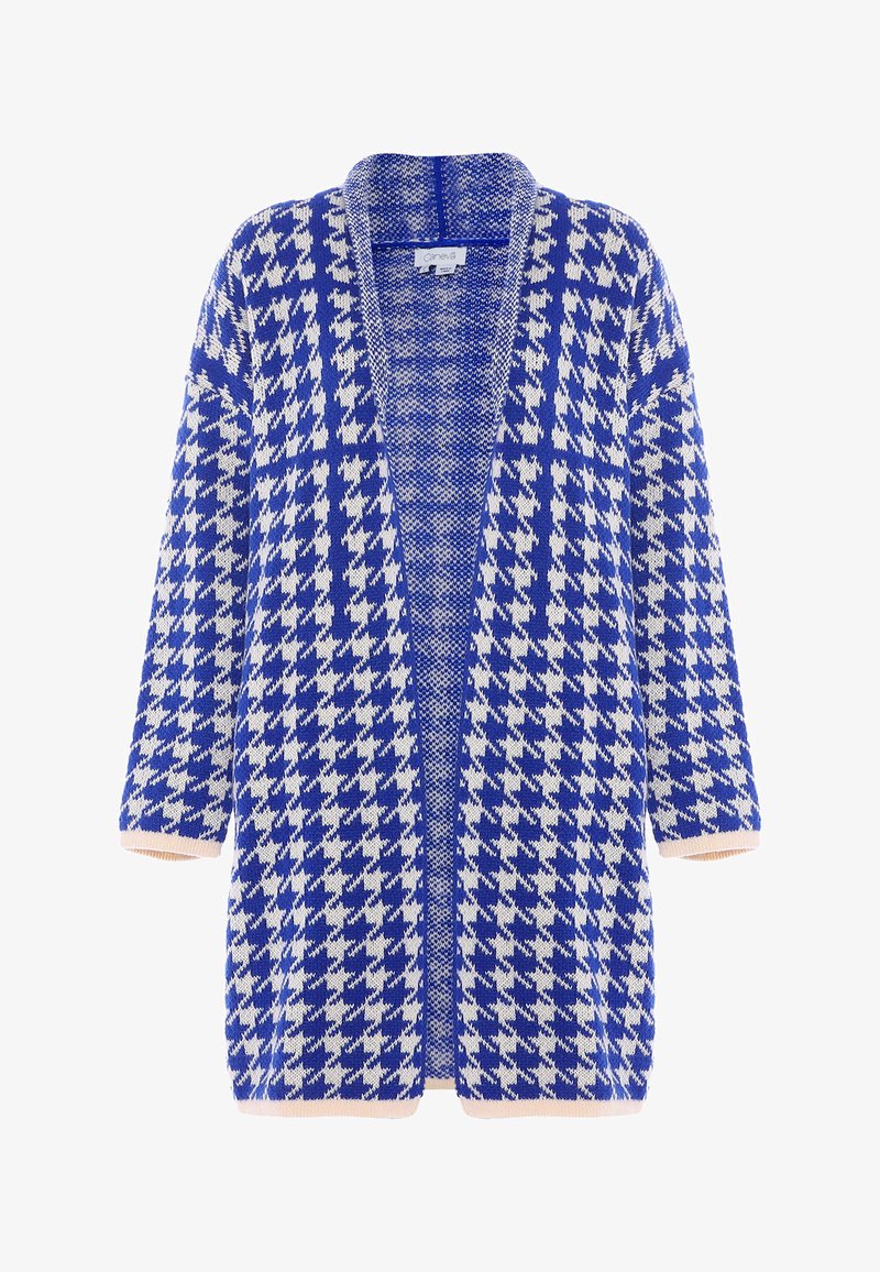 Blå och vit hounds-tooth kapun med öppen framsida, korta ärmar och ljusrosa accent vid ärmsluten, i ett strukturerat stickat tyg.
