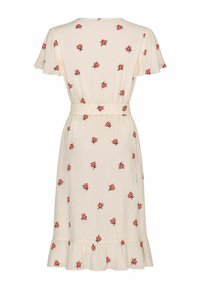 Robe midi crème avec manches volantées, ceinture à la taille, ourlet à volants et motif imprimé de coccinelles rouges sur toute la surface.