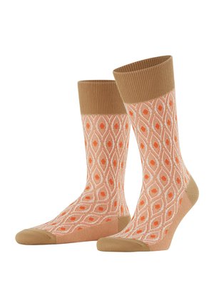 Orange patterned socks featuring a diamond design, with a ribbed tan cuff and a solid tan toe and heel. Made from a soft, flexible material.