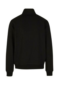 Felpa nera con colletto alto, maniche lunghe, polsini e orlo a coste, texture liscia e senza motivi o dettagli visibili.