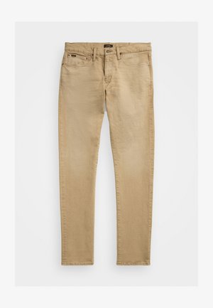 Jeans slim-fit bege feitos de algodão com um acabamento texturizado; apresentam bolsos padrão, fecho com botão e um pequeno logo na cintura.