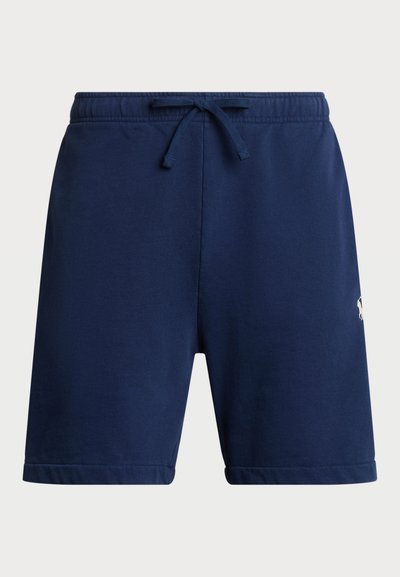Pantaloni corti in cotone blu navale con vita elasticizzata e cordoncino. Presentano tasche laterali e un piccolo logo sul lato inferiore della gamba.