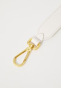 White textured leather strap with a gold-tone metal clip and hardware, featuring a smooth finish and rounded end detail.