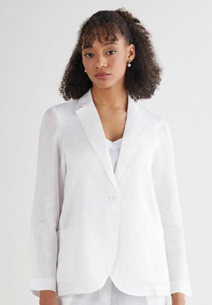 White linen blazer with a single button closure, notched lapels, two front pockets, and slightly tapered sleeves. Smooth texture.
