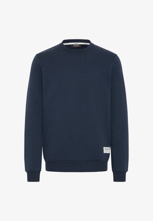 Granatowa bluza z okrągłym dekoltem, z prążkowanymi mankietami i dolnym wykończeniem, wykonana z miękkiego materiału. Posiada małą metkę na dolnej części przodu.