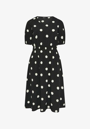 Sort midikjole med hvide polkaprikker, rund halsudskæring, korte pufærmer og elastisk taljedetalje.