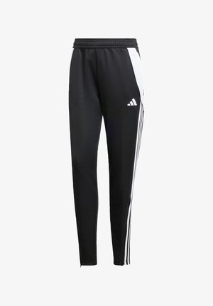 Svarta träningsbyxor med en avsmalnande passform, tillverkade av ett slätt tyg. Har vita sidostråk och en broderad logotyp på vänster ben.