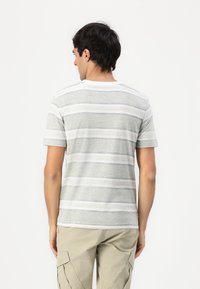 Gray and white striped t-shirt with a crew neckline, short sleeves, and a soft texture, shown from the back. Designed for casual wear.