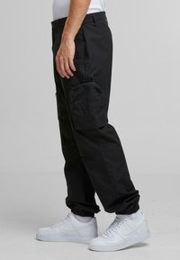 Urban Classics RIPSTOPLOOSE FIT  - Trousers - black