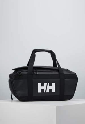 Black, waterproof duffel bag with dual top handles and a white logo. Features a zippered closure and sleek, angular design.