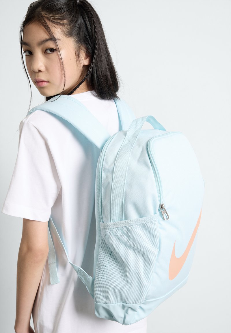 Nike Sportswear BRASILIA BACKPACK UNISEX - Rucksack - glacier blue/glacier  blue/(apricot agate)/blue - Zalando.co.uk