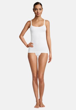 White cotton tank top with thin straps, fitted design, smooth texture, and a natural, soft drape, paired with white brief underwear.