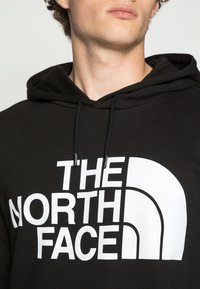 The North Face Jersey con capucha - black
