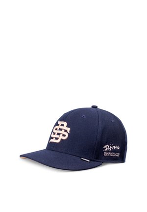Navy blue baseball cap with beige intertwined letters on front and small embroidered text on side reading "Djinns" and a slogan.