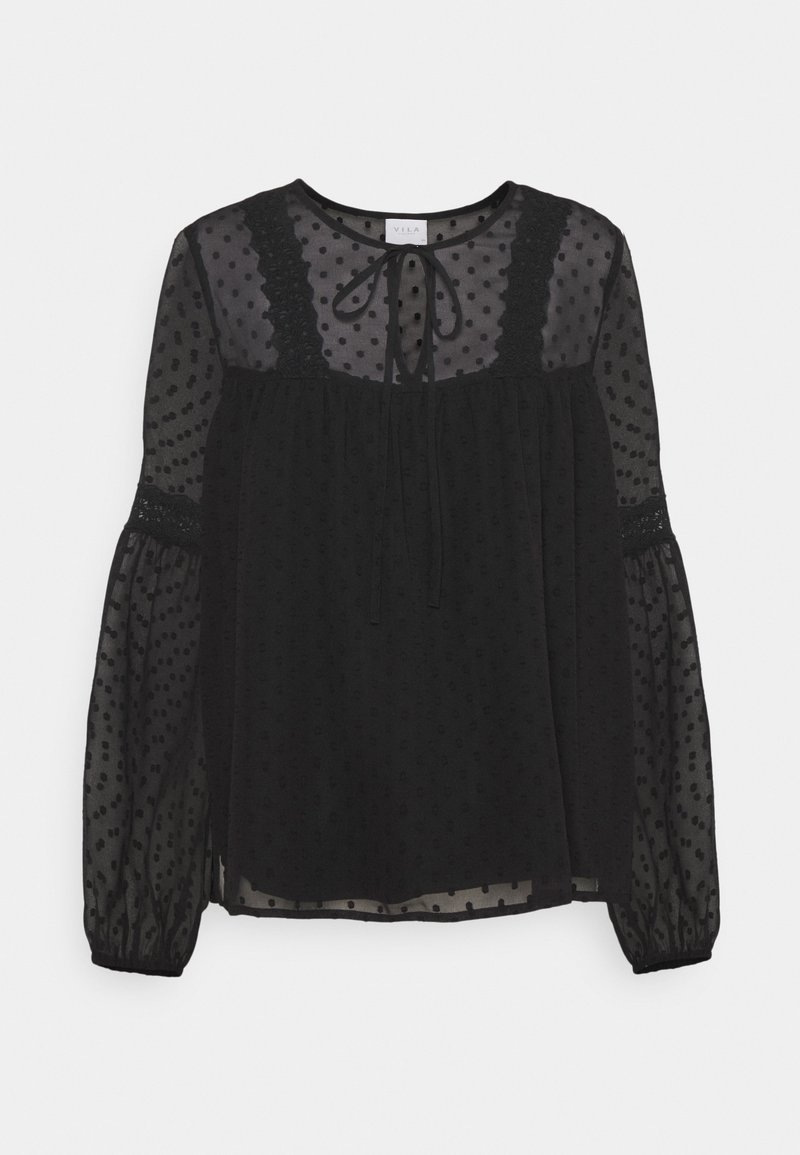 Svart genomskinlig blus med ett strukturerat polka dot-mönster, rund hals, och knyt detaljer, med spetsaccenter och puffärmar.