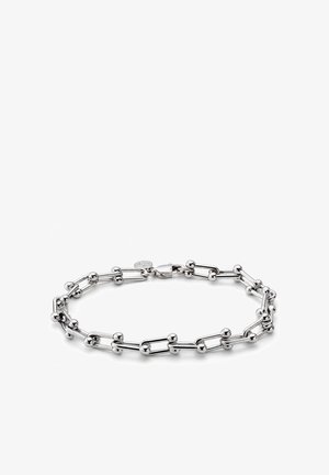 Armbånd i sølvfarve med aflangt led og små runde perler jævnt fordelt, med en kamskjoldslås og en lille rund vedhæng.