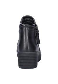 Zwarte leren enkelboots met een ronde neus, gestructureerde zijkant en ritsluiting met een kwastaccent. Geribbelde plateauzool.