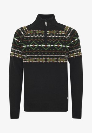 Svart genser med glidelås og høy hals, med et mønster i grønt, brunt og hvitt på brystet og ermene.