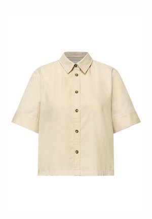 Chemise beige à manches courtes avec col pointu et boutons marron sur le devant.