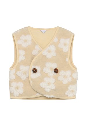 Gilet sans manches beige avec un motif floral blanc, fabriqué en tissu doux et texturé. Présente un design enveloppant et deux boutons marron.