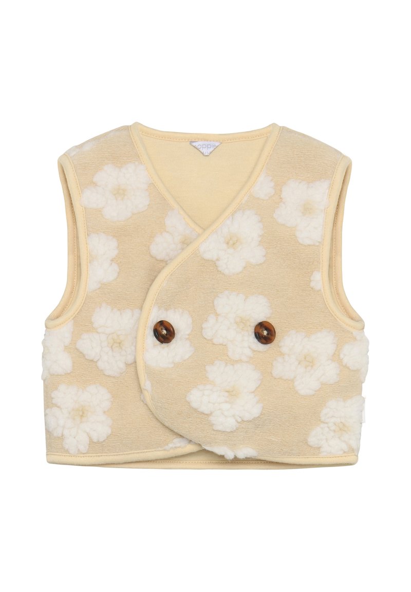 Beige ärmellose Weste mit weißem Blumenmuster, aus weichem strukturiertem Stoff. Verfügt über ein Wickeldesign und zwei braune Knöpfe.