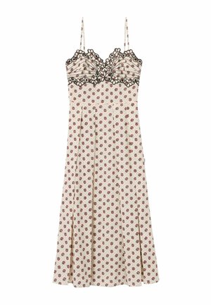 Robe crème sans manches avec petit motif floral rouge, bordure en dentelle noire à fleurs sur le buste et fines bretelles.