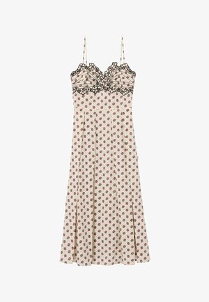 Vestido crema sin mangas con pequeño estampado floral rojo, borde floral de encaje negro en el busto y tirantes finos.