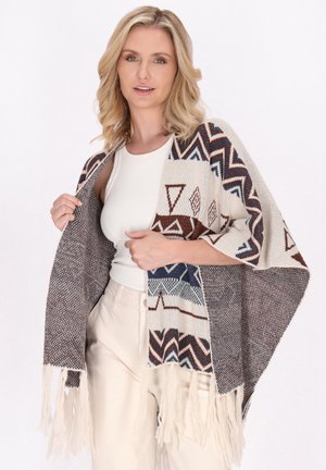 Écharpe tissée en crème, marron et bleu avec des motifs triangulaires. Présente des bords frangés et une forme ample. Texture douce.