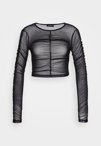 Haut noir cropped à manches longues en matériau en maille transparente. Présente des fronces le long des manches et à l'avant avec un col rond.