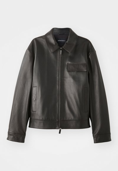 Black leather jacket with a collar, front zipper, and two side pockets. Features a chest pocket with flap detail and smooth texture.