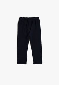 Pantalones de punto azul marino con cintura elástica, forma de pierna ajustada y dobladillos enrollados. La textura parece suave y acanalada.