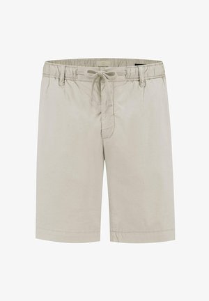 Heledad beežid puuvillased lühikesed püksid elastse vöökoha, nöörkatte ja küljetaskutega. Säärte soonikud minimaalsete õmblusdetailidega.