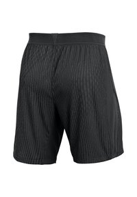 Zwarte sportshorts met een gestructureerd verticaal streeppatroon. Elastische tailleband en een iets relaxed pasvorm, gemaakt van ademende stof.