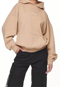 Pegador Jersey con capucha - sand