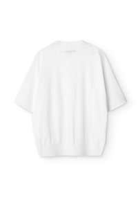 Haut blanc à manches courtes avec un col rond, une coupe décontractée et un ourlet élastiqué. Confectionné en tissu doux à la texture lisse.