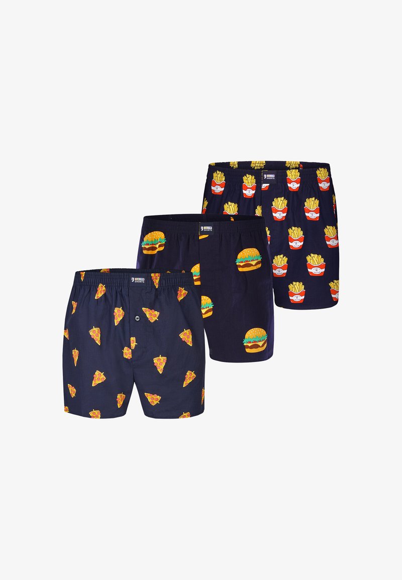 Trois boxers bleu marine avec des motifs alimentaires : tranches de pizza, hamburgers et boîtes rouges de frites.