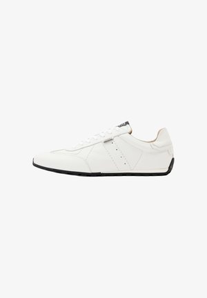 White low-top leather sneaker with lace-up front, black sole, and subtle perforated detailing on the side.